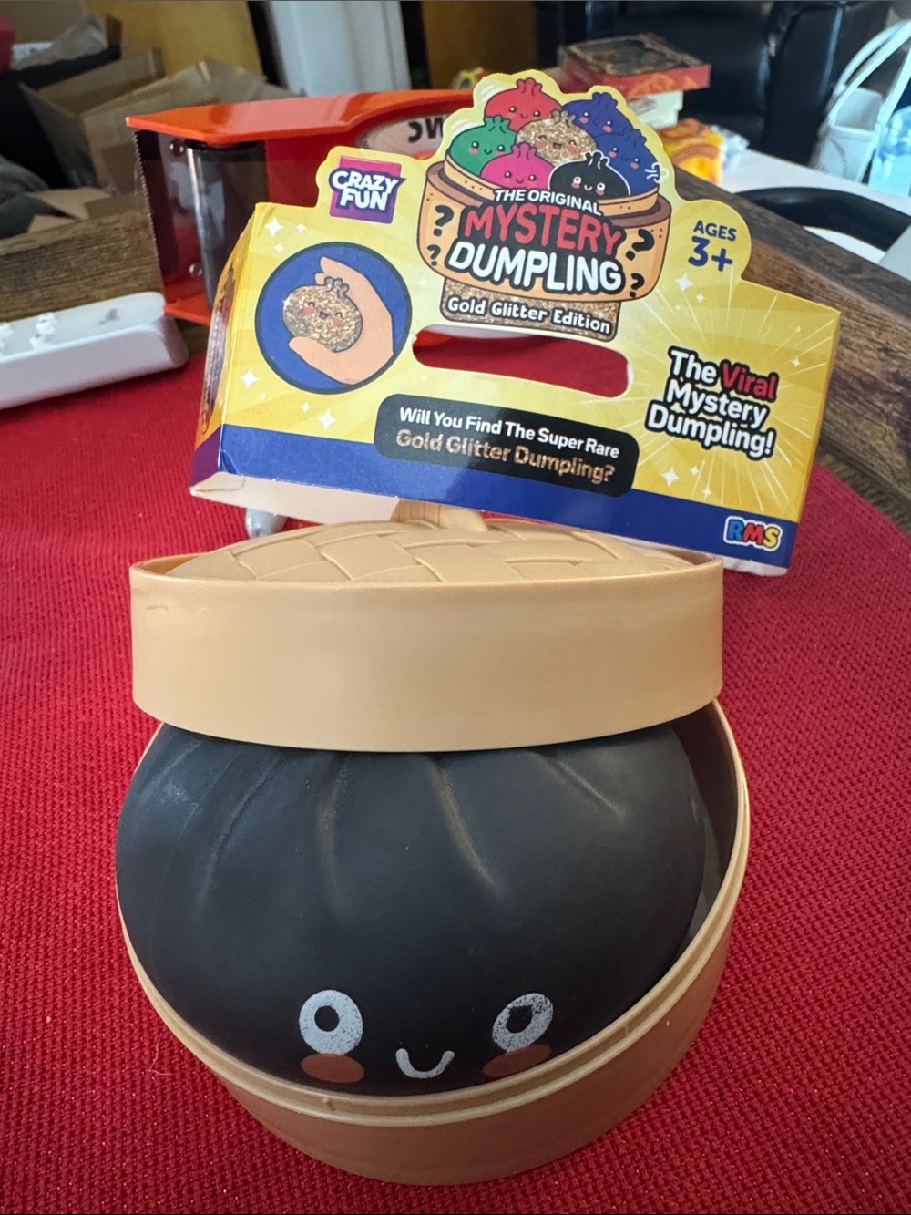 Mystery Dumpling Gold Glitter Edition Squishy Toy - Black & Tan unboxed